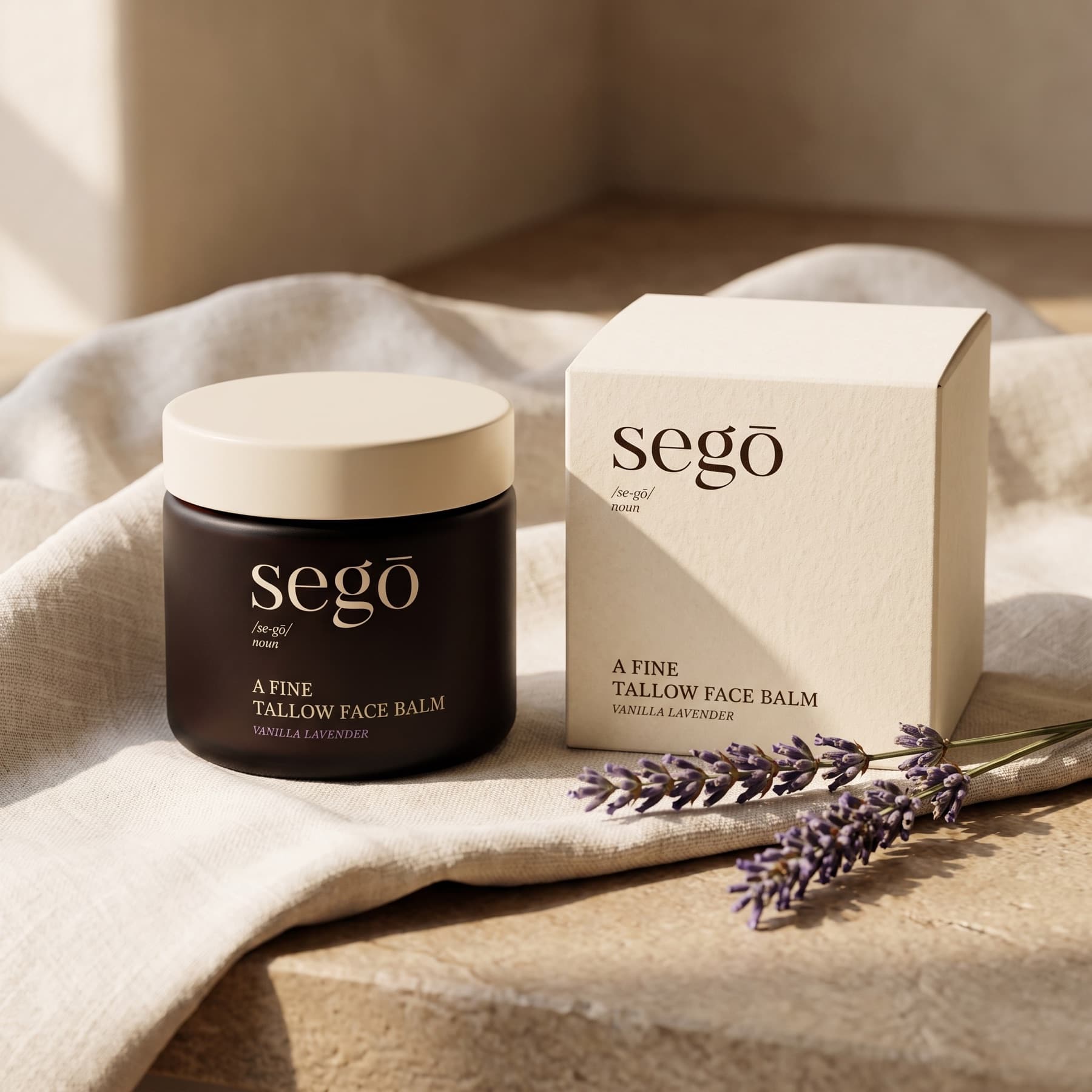 segō jar and box resting on soft linen beside lavender